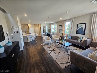 Living room with dark wood-style flooring, recesse
