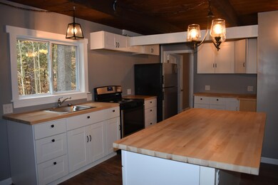 Leads to full bath and laundry area