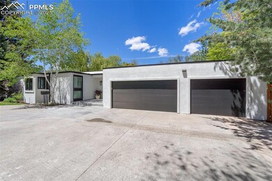 Garage featuring concrete driveway