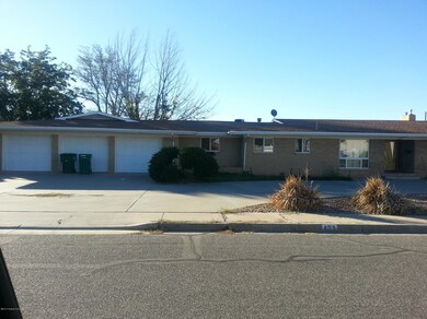 Front with view of 3 car garage