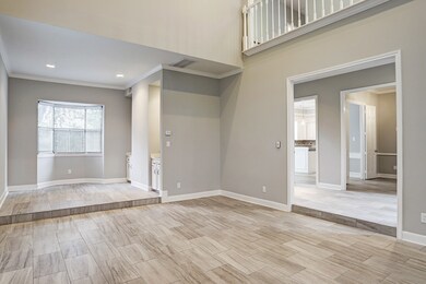 Spacious living room features an elevated wet bar