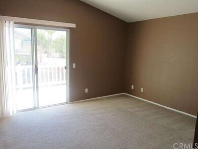 Master bedroom with deck overlooking backyard