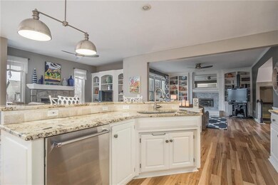 The kitchen showcases striking granite counters. I