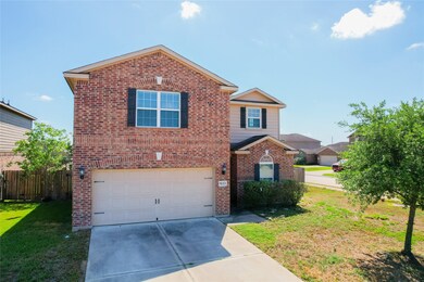 Charming two-story brick home with a two-car garag