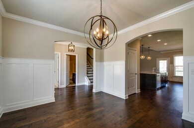 Open Plan with Arches and Craftsman Panel Detail. These are not actual pictures of home under construction