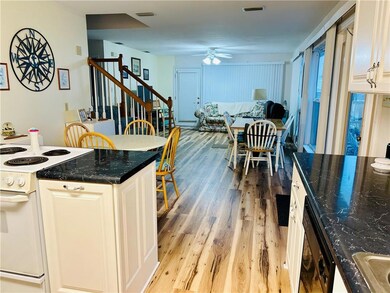 Kitchen featuring electric stove, light wood finis