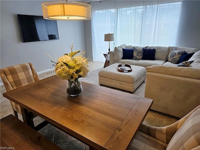 Living room with light tile patterned flooring