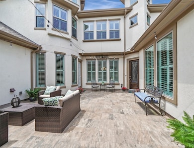 As you enter through the custom wood doors, you are welcomed with this wonderful courtyard.  The right door is the formal entry, and the left door is to the breakfast area. What a great place to have your morning coffee/tea or entertain in the evenings with cocktails.