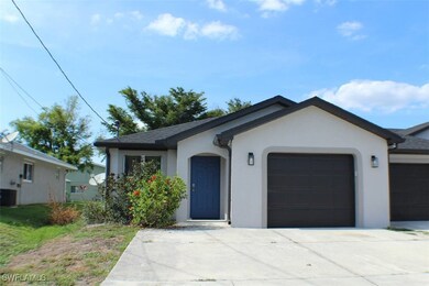 Ranch-style home with a garage, stucco siding, con