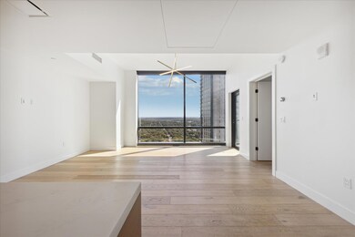 Unfurnished dining area featuring light wood-style flooring and expansive windows