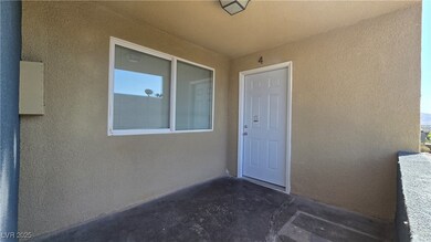 View of exterior entry with stucco siding
