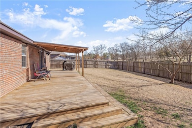backyard, covered concrete patio with extended woo