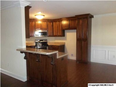 BEAUTIFUL LARGE KITCHEN WITH CUSTOM CABINETS AND BAR AREA