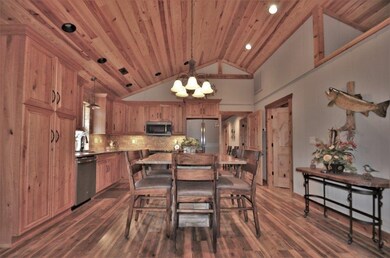 Open Kitchen and Dining.  Stone backsplash in Kitc