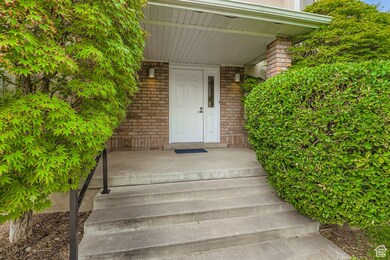 Property entrance featuring brick siding