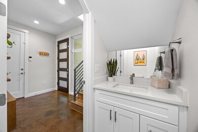 Foyer entrance featuring finished concrete floors