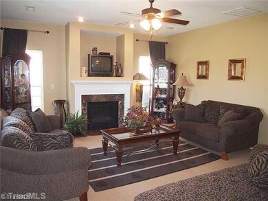 Den/Family/Great Room. Picture perfect.  Four windows for lots of light.  Gas logs in fireplace and niche for television.  House is soundproofed and has double paned windows as well.  Quiet and solitude.