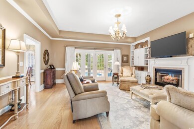 Living room with french doors, light wood-type flo