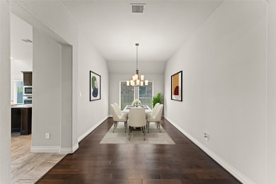 The formal dining room is bright and elegant, with
