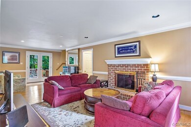  Brick wood-burning Fireplace, hardwood floors, crown molding, chair rail, recessed lighting