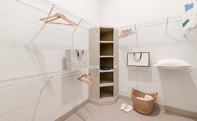 Walk in closet with full size w/d not shown.