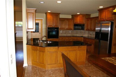 Kitchen with granite counters.