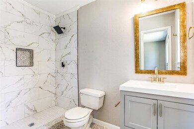 Master bath features a beautifully tiled shower and brand new granite topped vanity.