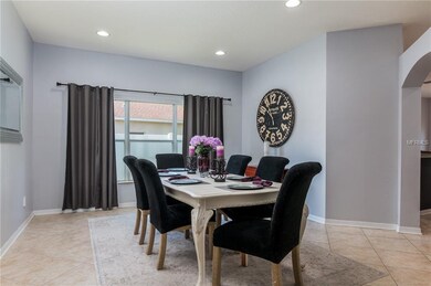 Spacious formal dining room.   Curtains do not con