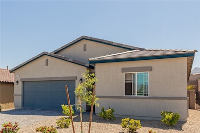 View of front facade featuring a garage, decorativ