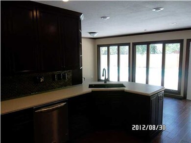 Kitchen, looking out over the back yard & pool. Op