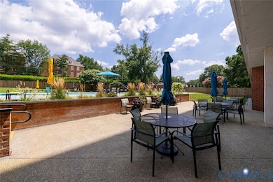 View of patio / terrace featuring outdoor dining space and a community pool