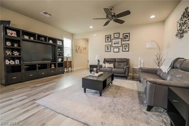 Stunning great room plan with shutters, ceiling fa
