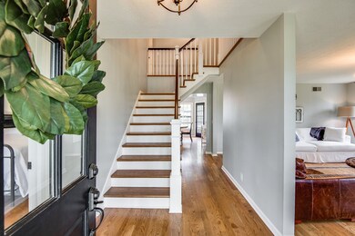 Grand entry way. All new stairs and banister! Wood floors new! 