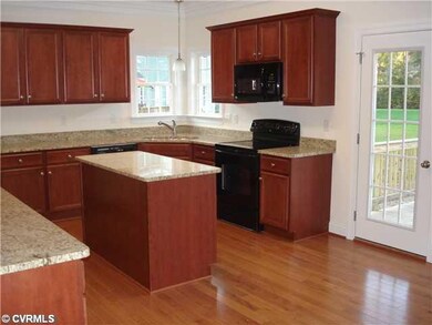 Kitchen - Custom cabinets with granite. Opens to g