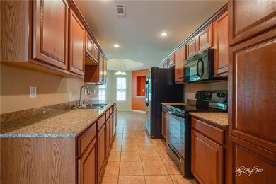 Granite countertops, all appliances convey.