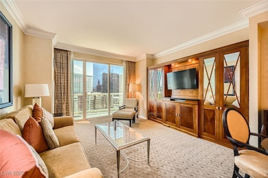 Carpeted living room featuring ornamental molding