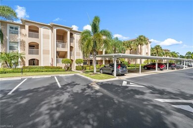 View of parking featuring a carport