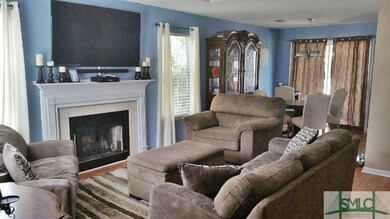 Wood burning fireplace with tile surround.