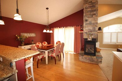 Dining Area w/Wood Floors opens to Deck