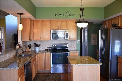 Kitchen boasts granite counters, stainless applian