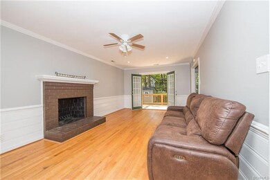 Family room with hardwood floors, fireplace and re