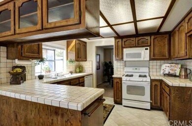Sun splashed kitchen with plenty of space for prep