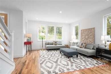 Oversized Windows Bathe the Living Room in Natural Light
