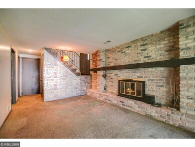 Basement with fireplace.