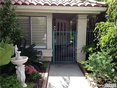 Lush landscaping and gated entry.