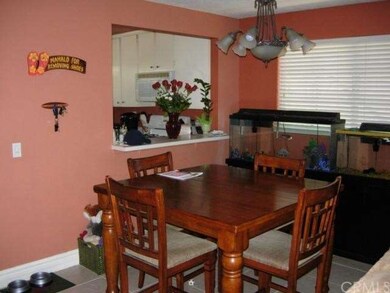 Sunny kitchen with convenient opening to dining ar