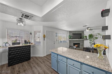 Kitchen with dark wood-type flooring,  and blue ca