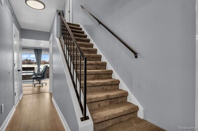 Stairway featuring baseboards and wood finished floors