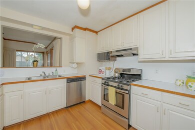Kitchen featuring light wood-type flooring, sink,