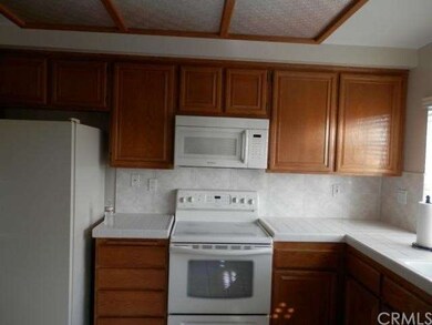 Kitchen with Electric Stove, and lots of cabinets 